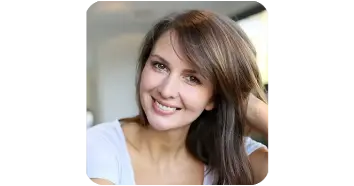Woman smiling while sharing her personal experience with a wellness supplement